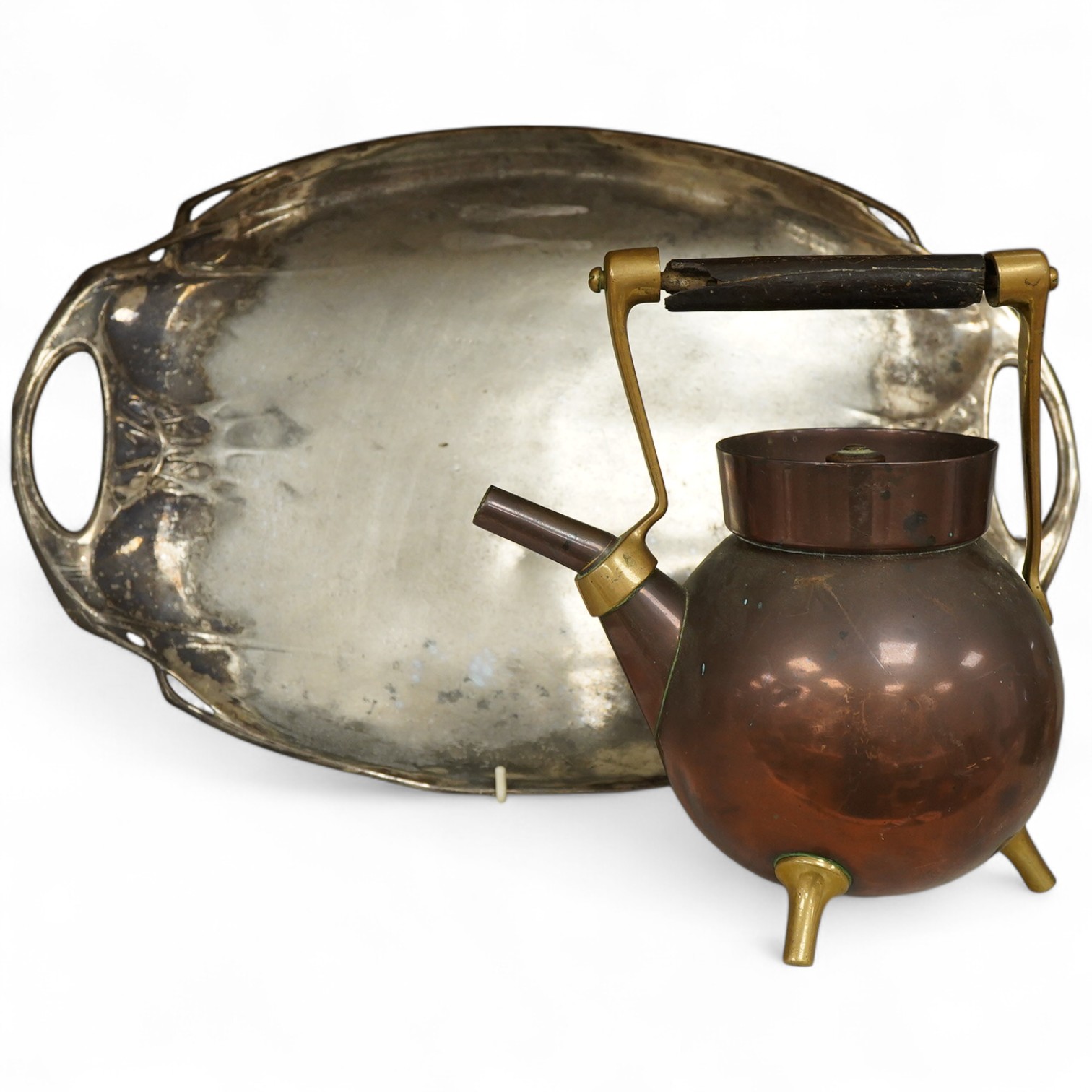 An Arts and crafts copper and brass Bentham Froud stamped Christopher Dresser teapot, (A.F), together with a two handle tray stamped Torini &Sons, Tray 49cm wide.